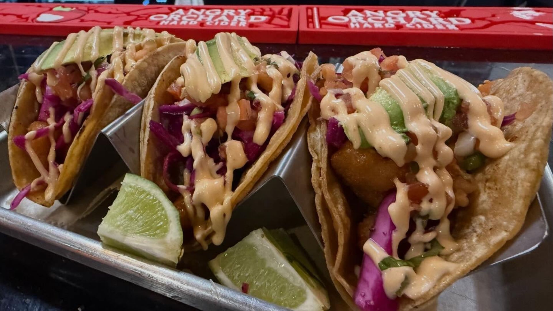 Platter of authentic Mexican street tacos with fresh toppings at Atwater Street Tacos.