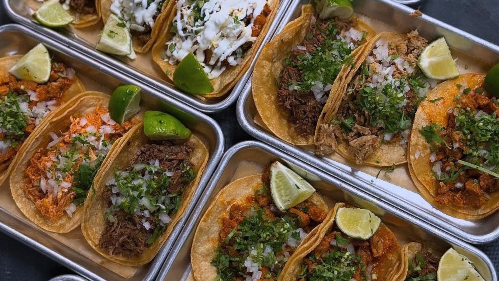 A vibrant and welcoming family dining area inside Atwater Street Tacos, showcasing an assortment of colorful and delicious Mexican street tacos.