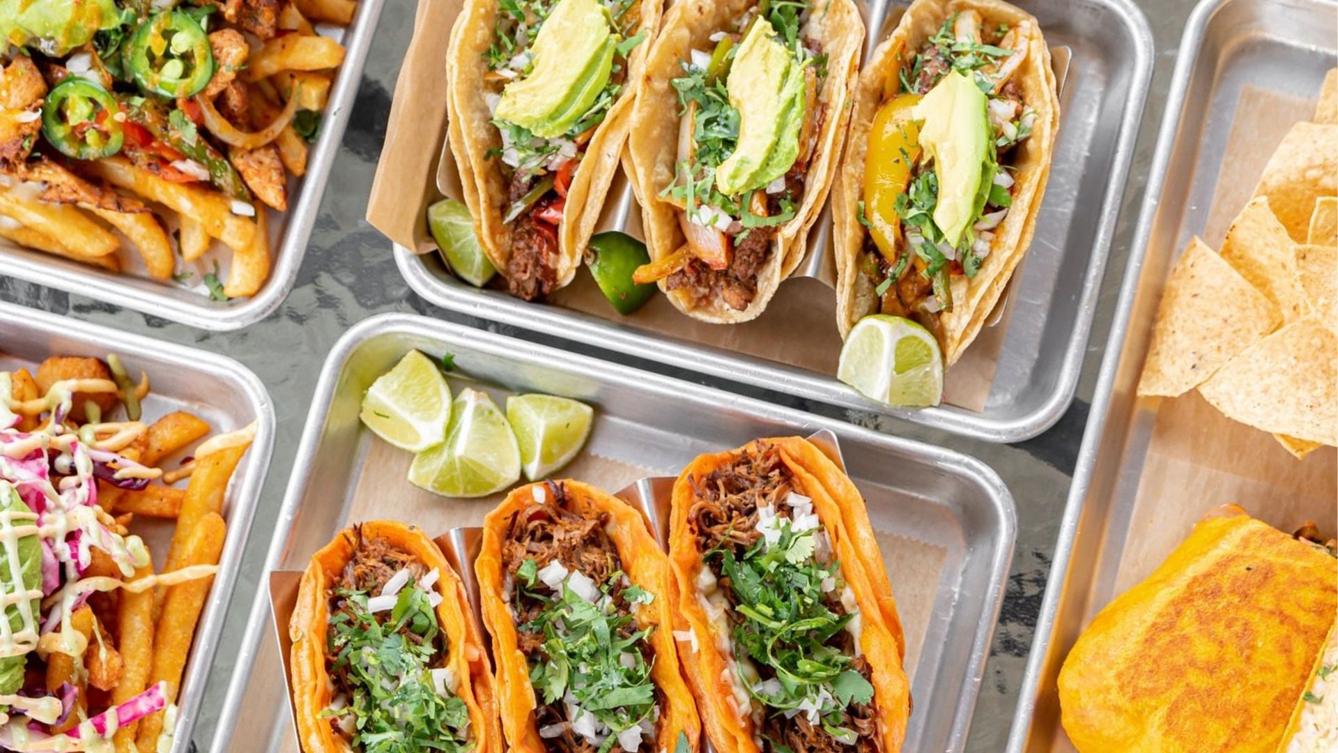 Featured image showcasing a platter of assorted street tacos with vibrant toppings at Atwater Street Tacos in Monroe.